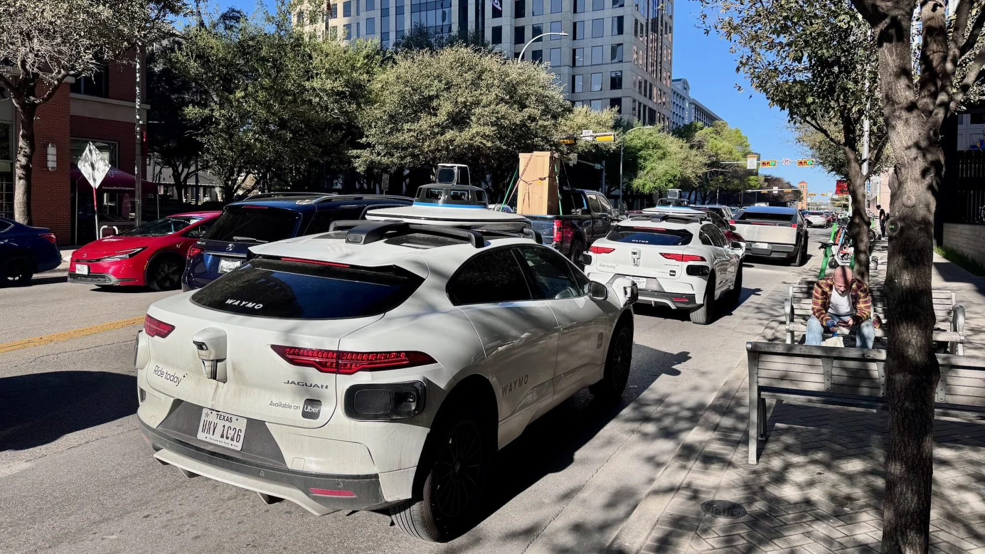 two waymos in traffic in austin, texas