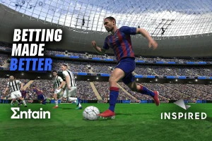 Entain and Inspired virtual soccer betting game inside stadium simulation with players and sportsbook branding for online betting partnership.