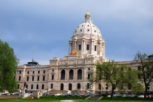 Minnesota bill would criminalize sports, political, and disaster prediction markets in state. The dome of the Minnesota State House rises over the legislative branches of the building